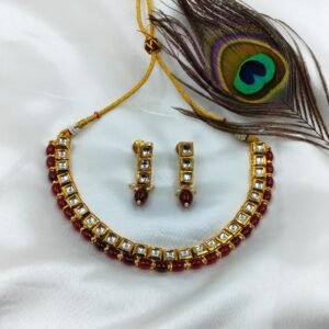 Add timeless charm to your look with our Ruby Square Kundan Set featuring clear kundan stones and red bead accents. Shop now at www.radiantjewels.store!